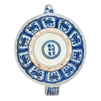 Lot 44: Blue and White Monk's Cap Ewer with Eight Auspicious Symbols 青花莲托八宝纹僧帽壶