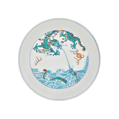 Lot 46: Doucai Dish Depicting a Dragon Teaching Its Young 斗彩苍龙教子图折腰盘